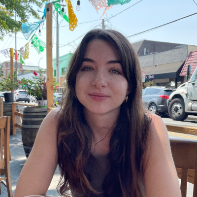 Lindsay Sohn sitting outside at a cafe